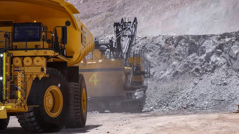 Heavy mining machinery extracting minerals in open pit mine
