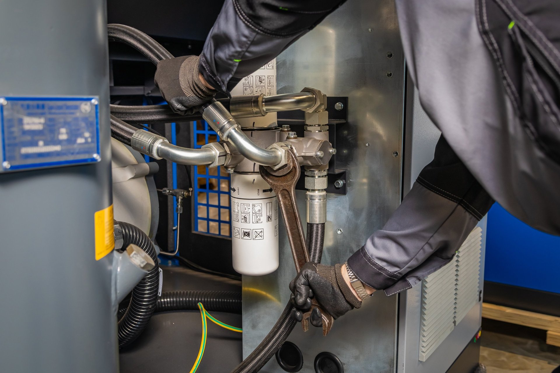 Hydraulic technician working on industrial equipment maintenance