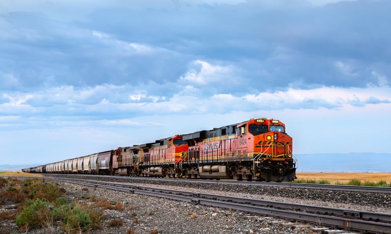 BNSF freight train travels through rural plains